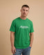 Man wearing a green t-shirt with 'Montavor' logo on a beige background