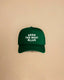 High-profile trucker cap featuring “Keep The West Alive” western typography on the front with mesh back and curved peak.