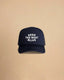 High-profile trucker cap featuring “Keep The West Alive” western typography on the front with mesh back and curved peak.