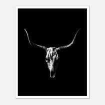 Black and white photograph of a longhorn skull with wide sweeping horns centered against a dark background, western wall art poster.