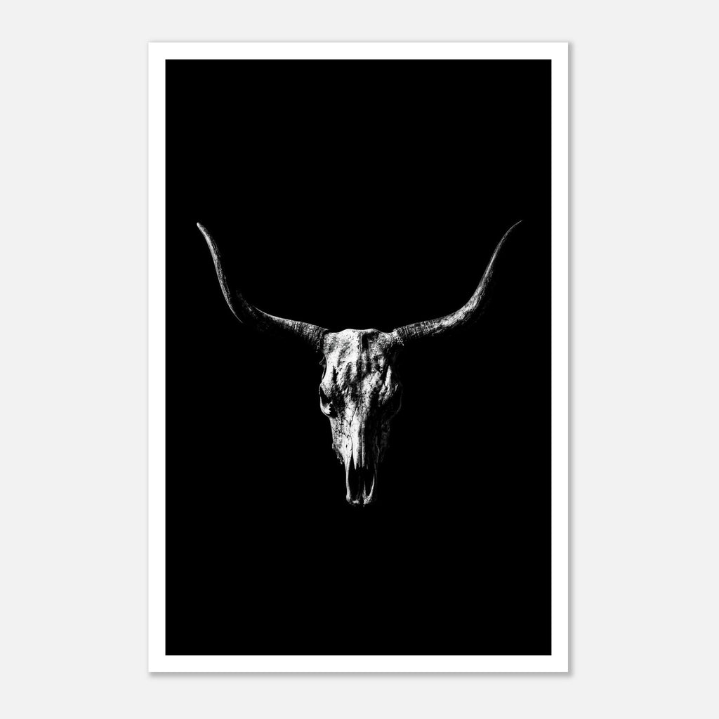 Black and white photograph of a longhorn skull with wide sweeping horns centered against a dark background, western wall art poster.