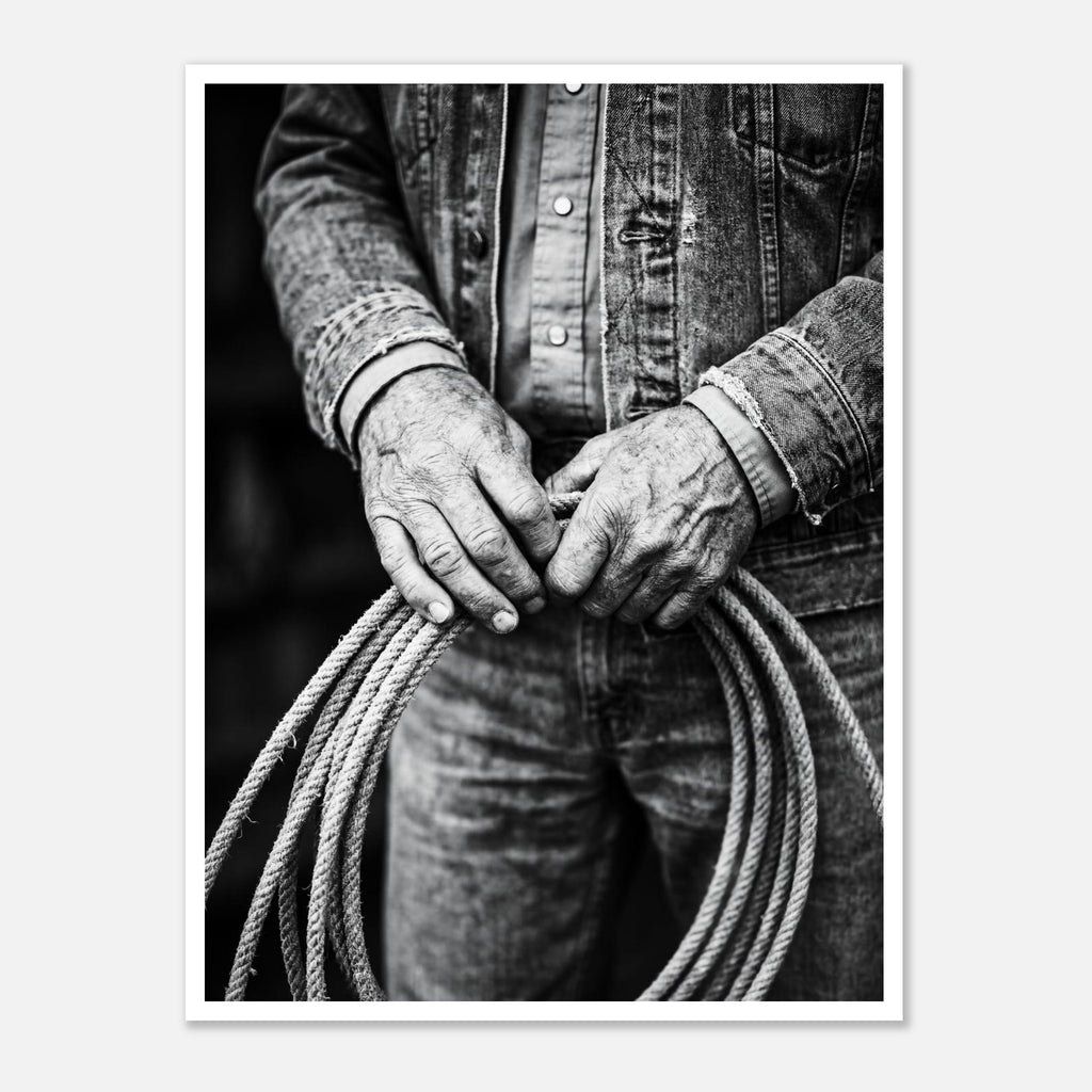 Black and white photograph of cowboy hands holding a coiled rope wearing denim, western ranch wall art.