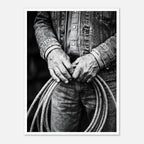 Black and white photograph of cowboy hands holding a coiled rope wearing denim, western ranch wall art.