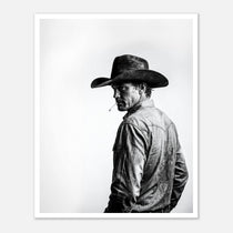 Black and white photograph of a rodeo cowboy wearing a western hat and cigarette, turning toward the camera after competition, western cowboy wall art poster.
