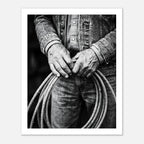 Black and white photograph of cowboy hands holding a coiled rope wearing denim, western ranch wall art.