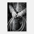 Black and white photograph of cowboy hands holding a coiled rope wearing denim, western ranch wall art.