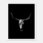 Black and white photograph of a longhorn skull with wide sweeping horns centered against a dark background, western wall art poster.