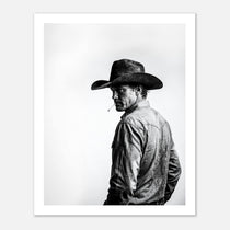 Black and white photograph of a rodeo cowboy wearing a western hat and cigarette, turning toward the camera after competition, western cowboy wall art poster.