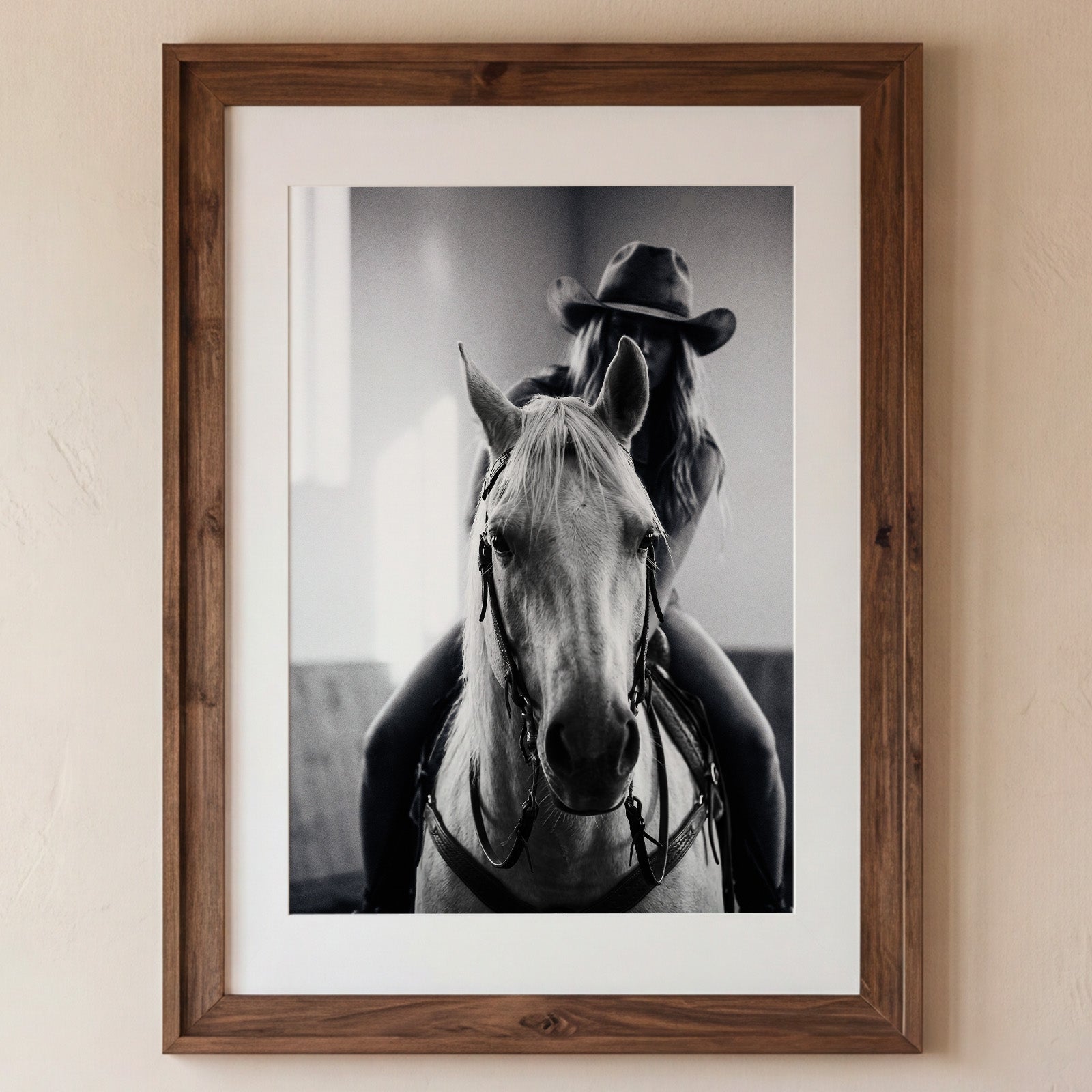 Black and white photograph of a cowgirl riding a horse head on wearing a cowboy hat, western equestrian wall art. Main image