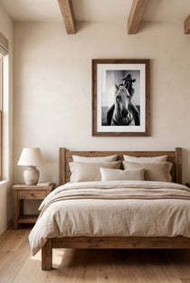 Black and white photograph of a cowgirl riding a horse head on wearing a cowboy hat, western equestrian wall art.