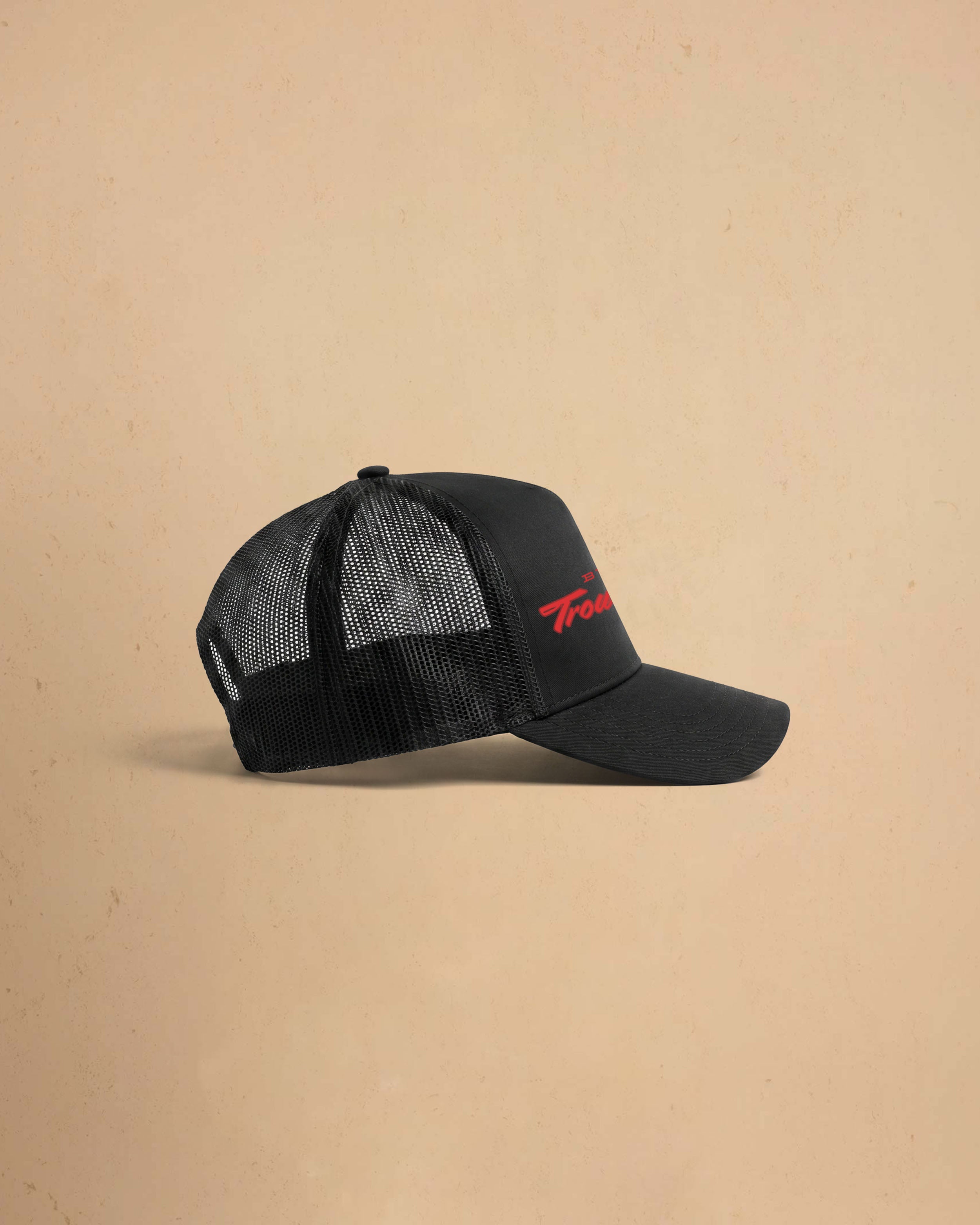 Built For Trouble trucker cap featuring a bold Western-inspired graphic on a high-profile foam-front snapback cap with breathable mesh backing.