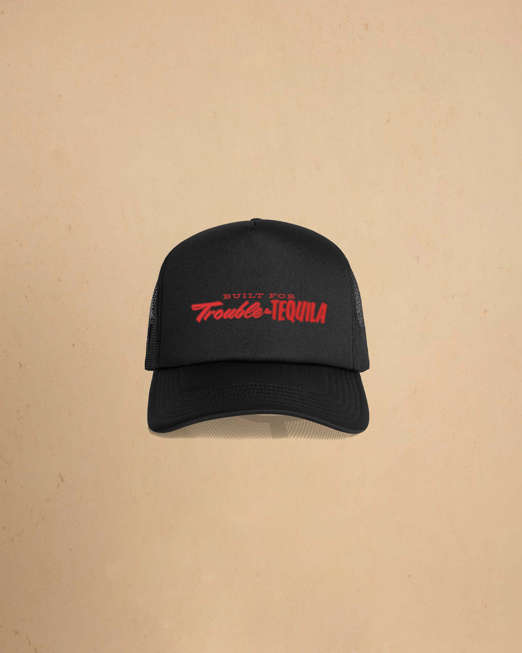 Built For Trouble trucker cap featuring a bold Western-inspired graphic on a high-profile foam-front snapback cap with breathable mesh backing.