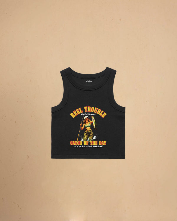 Women’s Reel Trouble organic crop tank featuring a vintage fishing pin-up graphic with retro western styling and heavyweight ribbed cotton construction.