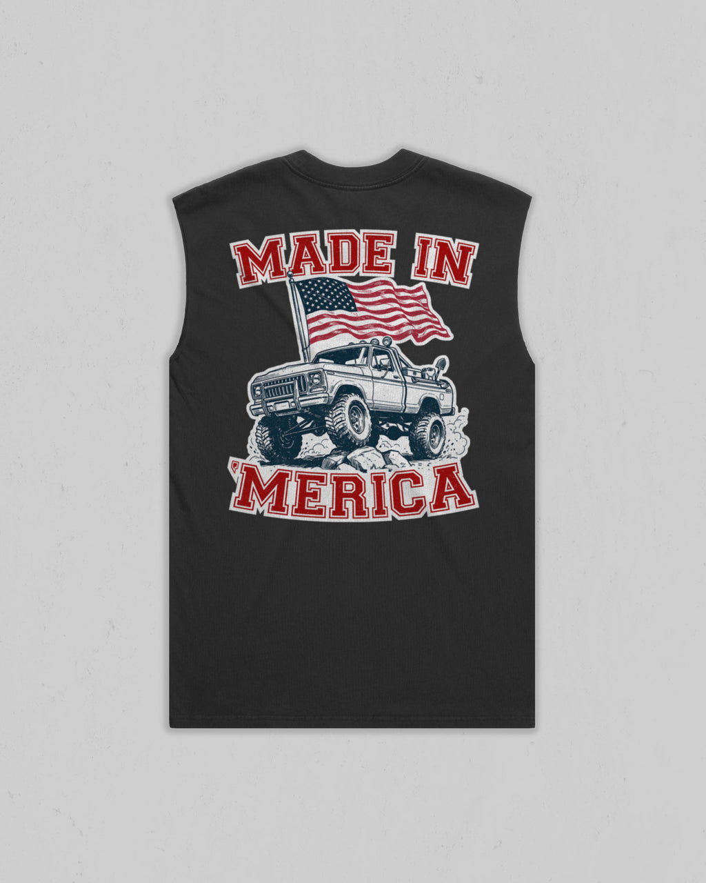 A sleeveless black t-shirt with a graphic on the front featuring a white pickup truck, an American flag, and the text 'MADE IN MERICA' in red and white, displayed against a light gray background.