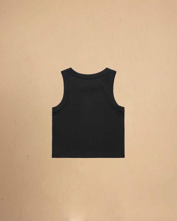 Black tank top on a beige background