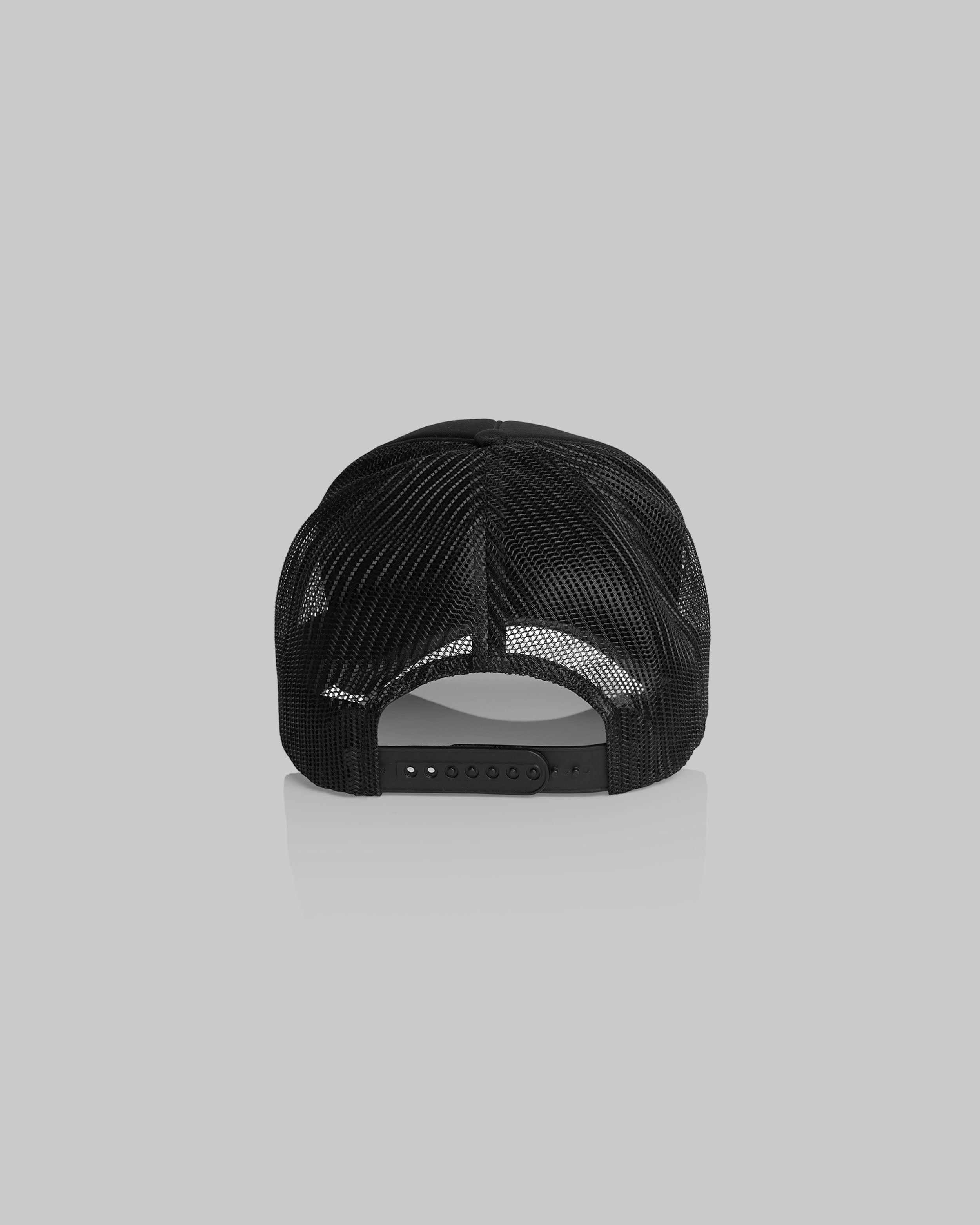 Black trucker-style cap shown from the back, featuring a black mesh back and an adjustable snap closure, set against a solid gray background.