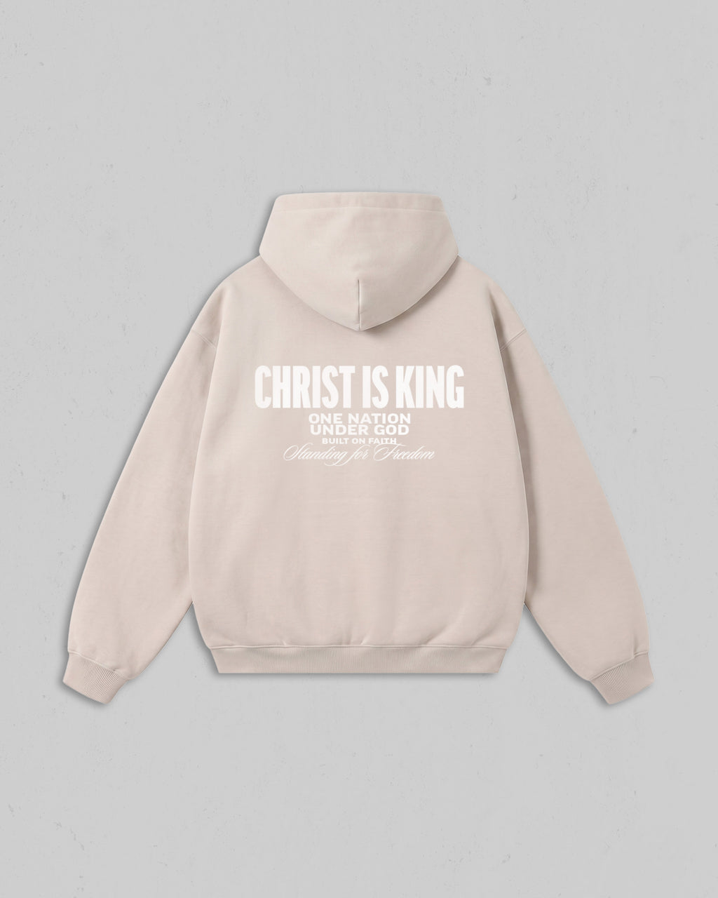 Back view of women’s Beige Christ Is King hoodie with bold white Christian 