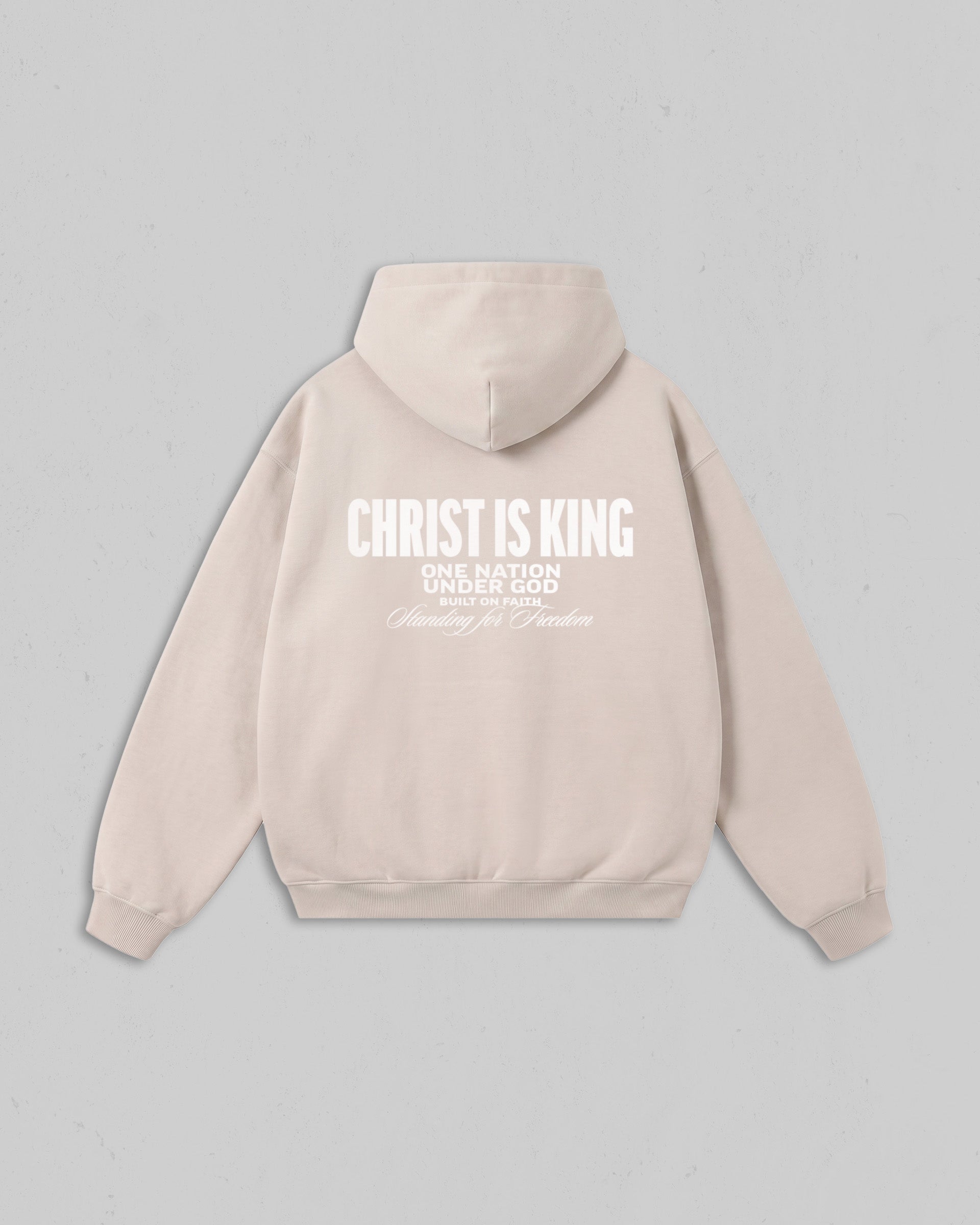 Back view of women’s Beige Christ Is King hoodie with bold white Christian 