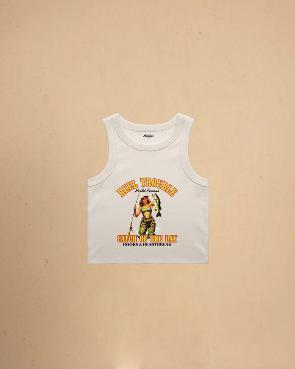 Women’s Reel Trouble organic crop tank featuring a vintage fishing pin-up graphic with retro western styling and heavyweight ribbed cotton construction.