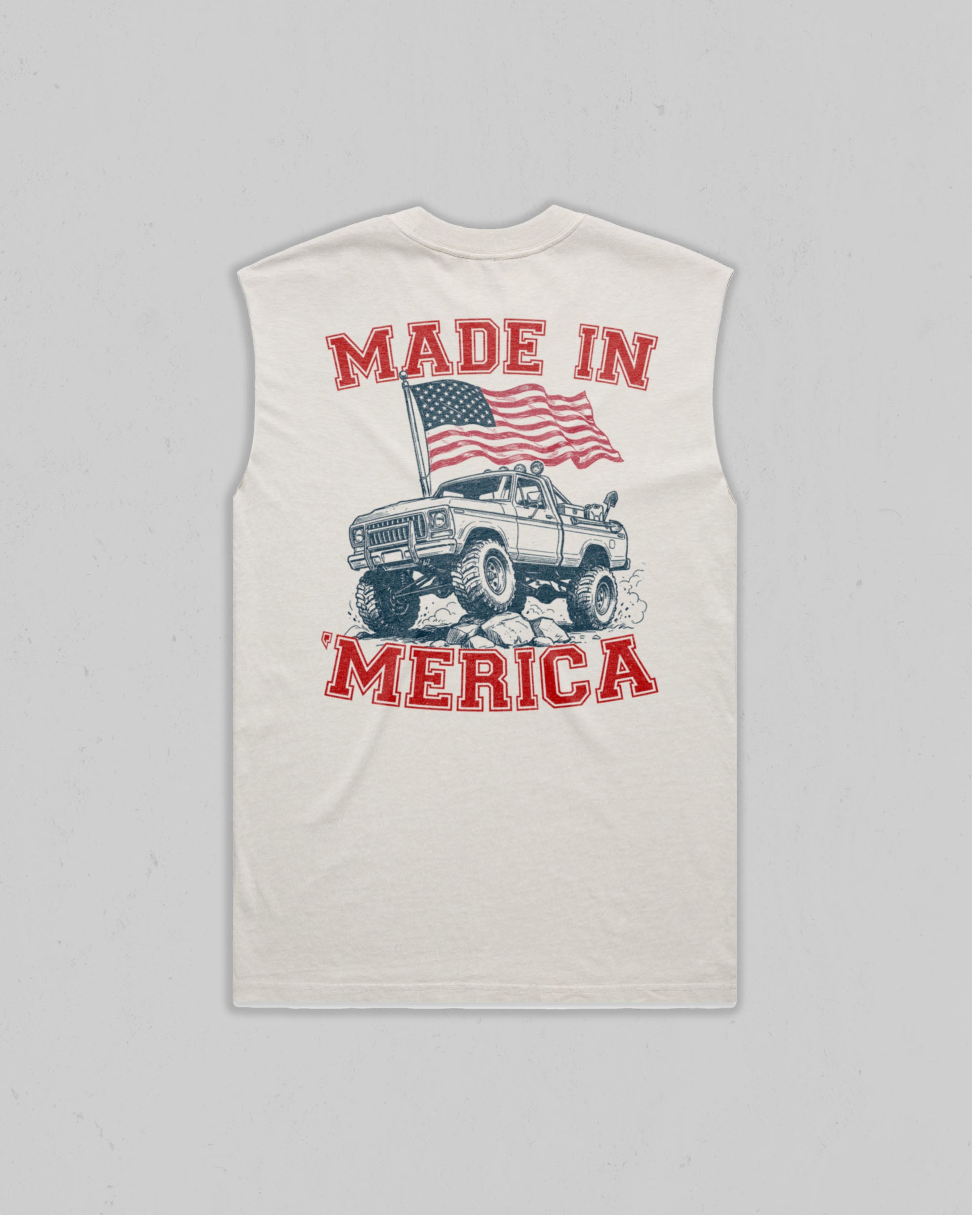 A sleeveless white tank top with a large graphic print on the front. The graphic features the text 'MADE IN MERICA' in red, an American flag, and a vintage off-road pickup truck illustration.
