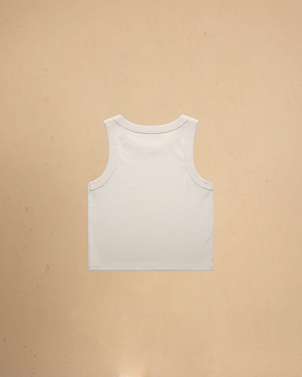Bone tank top on a beige background