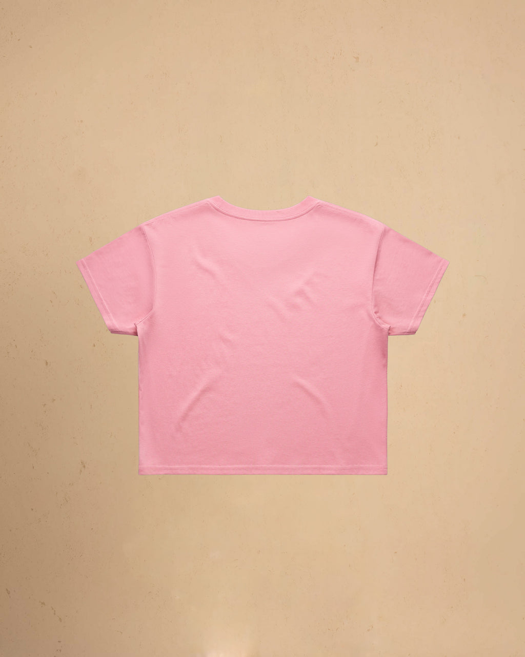 Pink t-shirt on a beige background