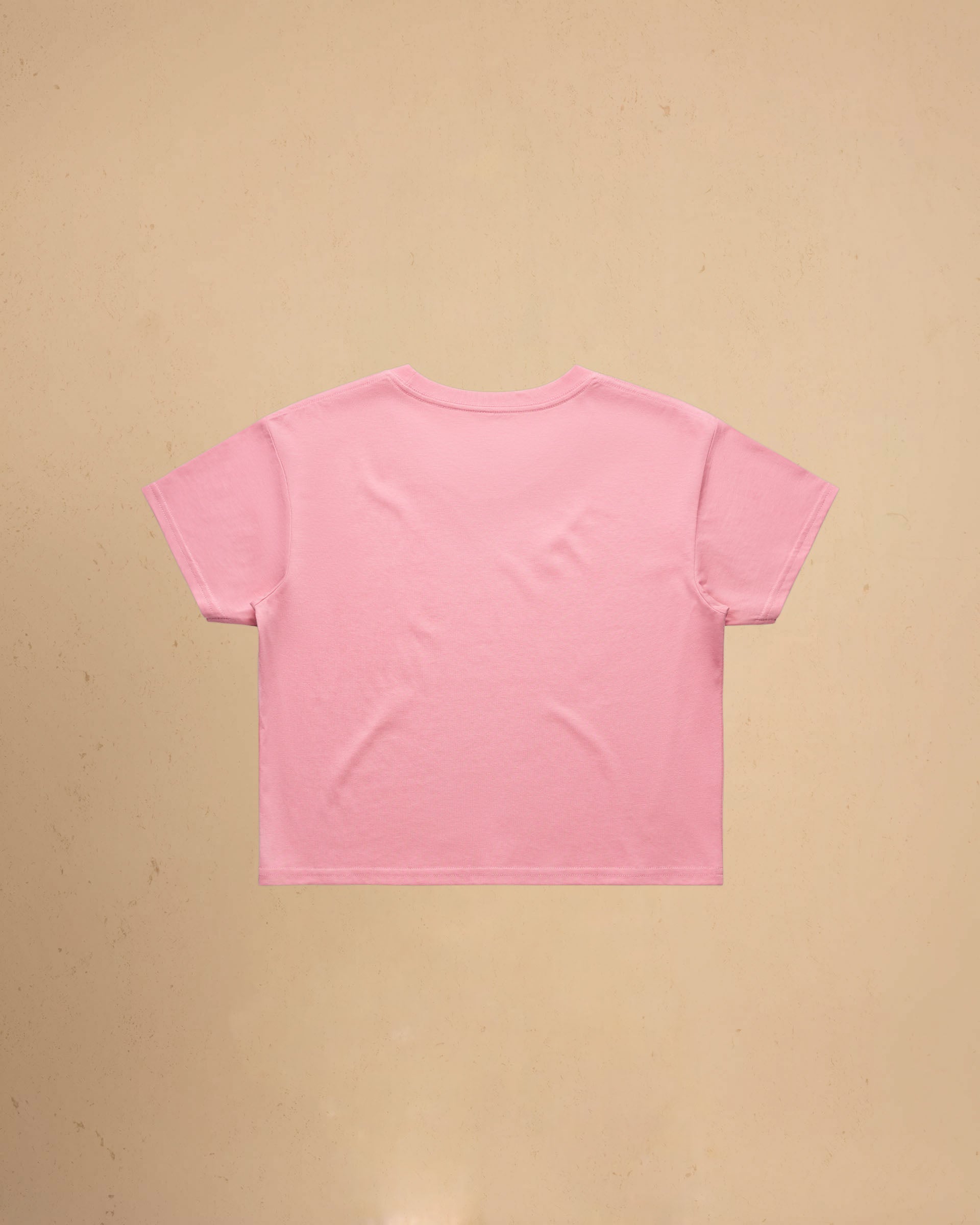 Pink t-shirt on a beige background