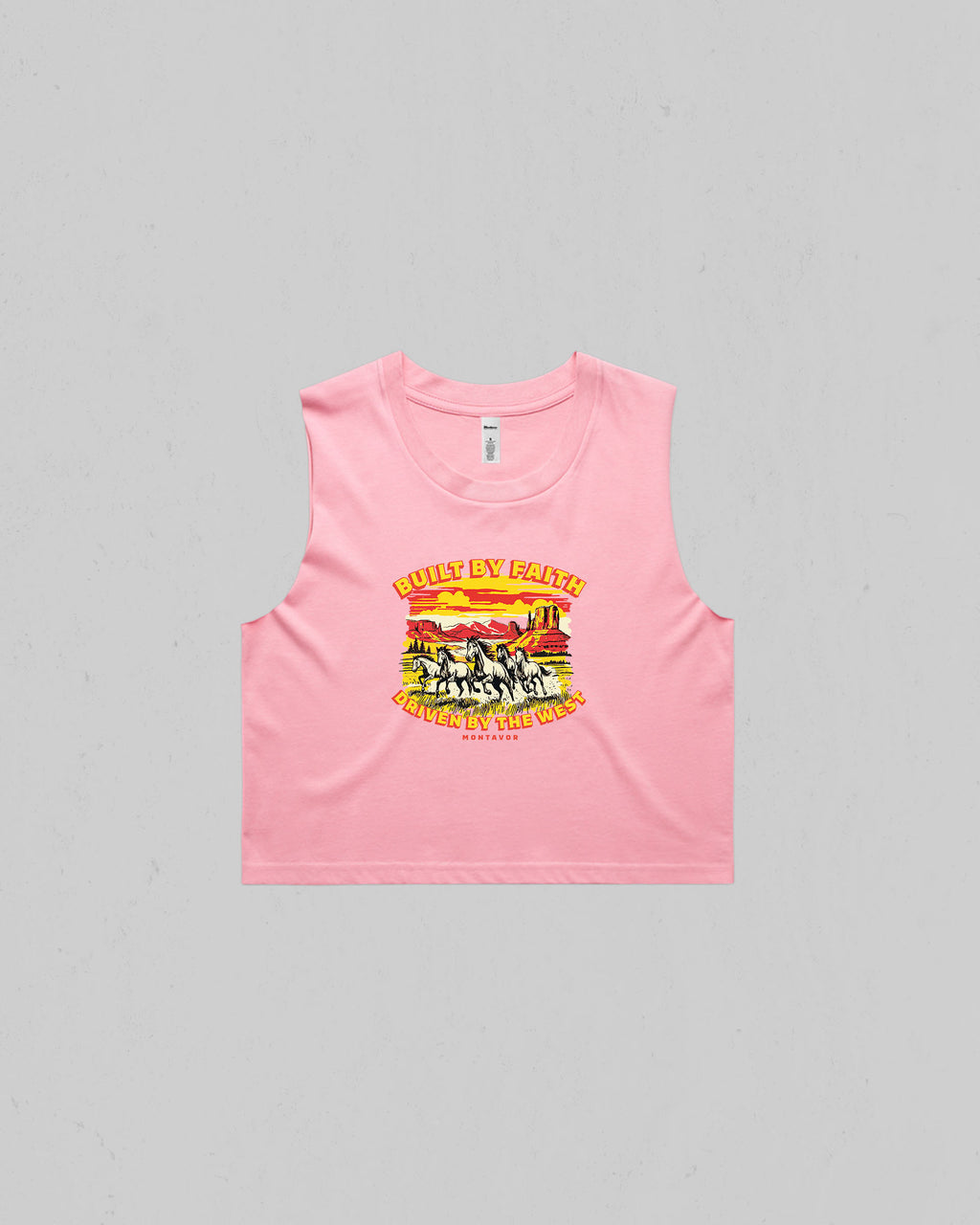 Pink Women’s “Built By Faith, Driven By The West” crop tank top featuring a vintage western horse and desert graphic by Montavor.