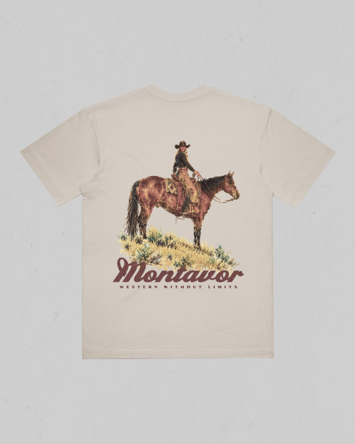 Montavor women’s Cowgirl T-shirt, back view featuring a cowgirl on horseback above the Montavor logo and Western Without Limits slogan.