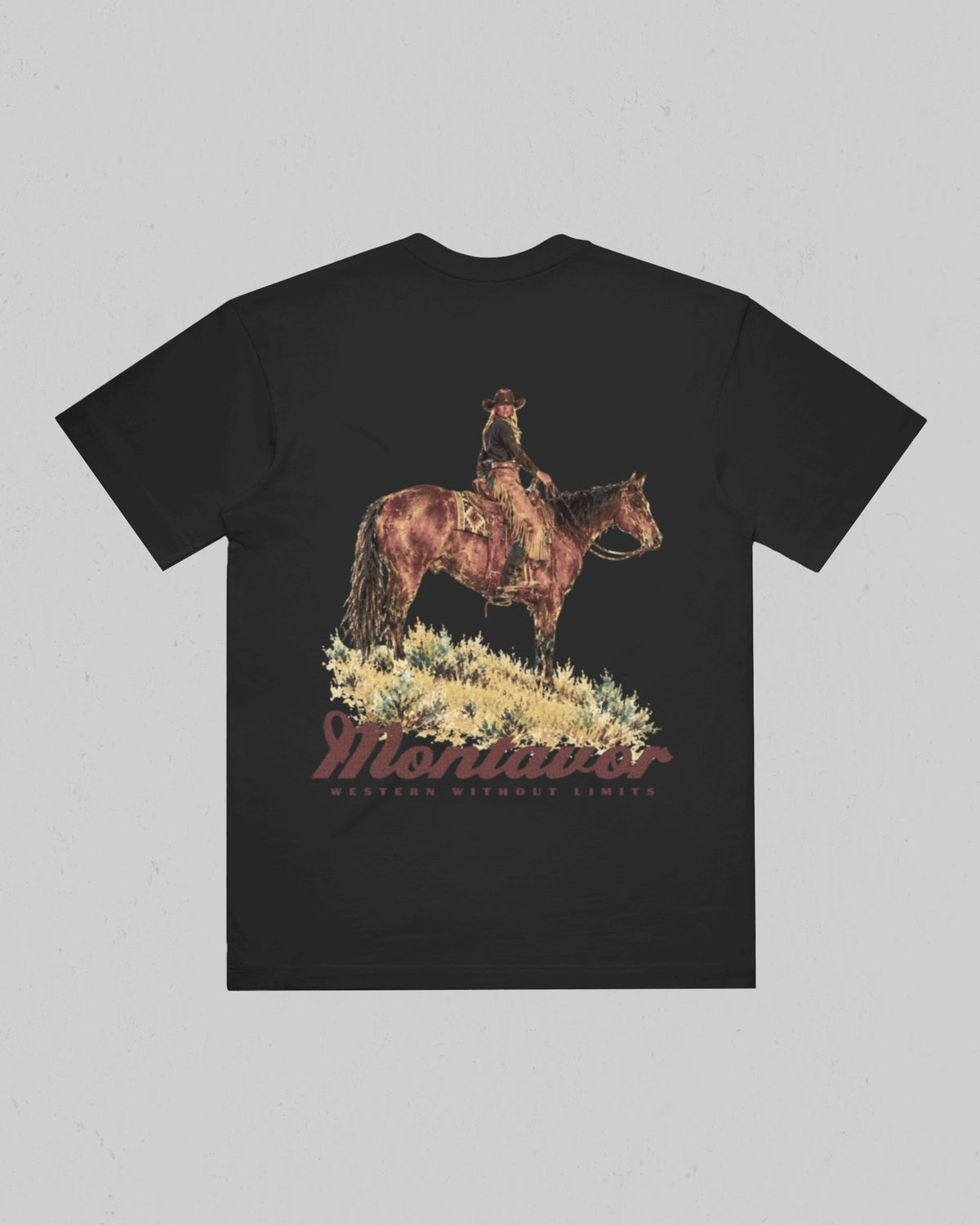 Montavor women’s Cowgirl T-shirt, back view featuring a cowgirl on horseback above the Montavor logo and Western Without Limits slogan.