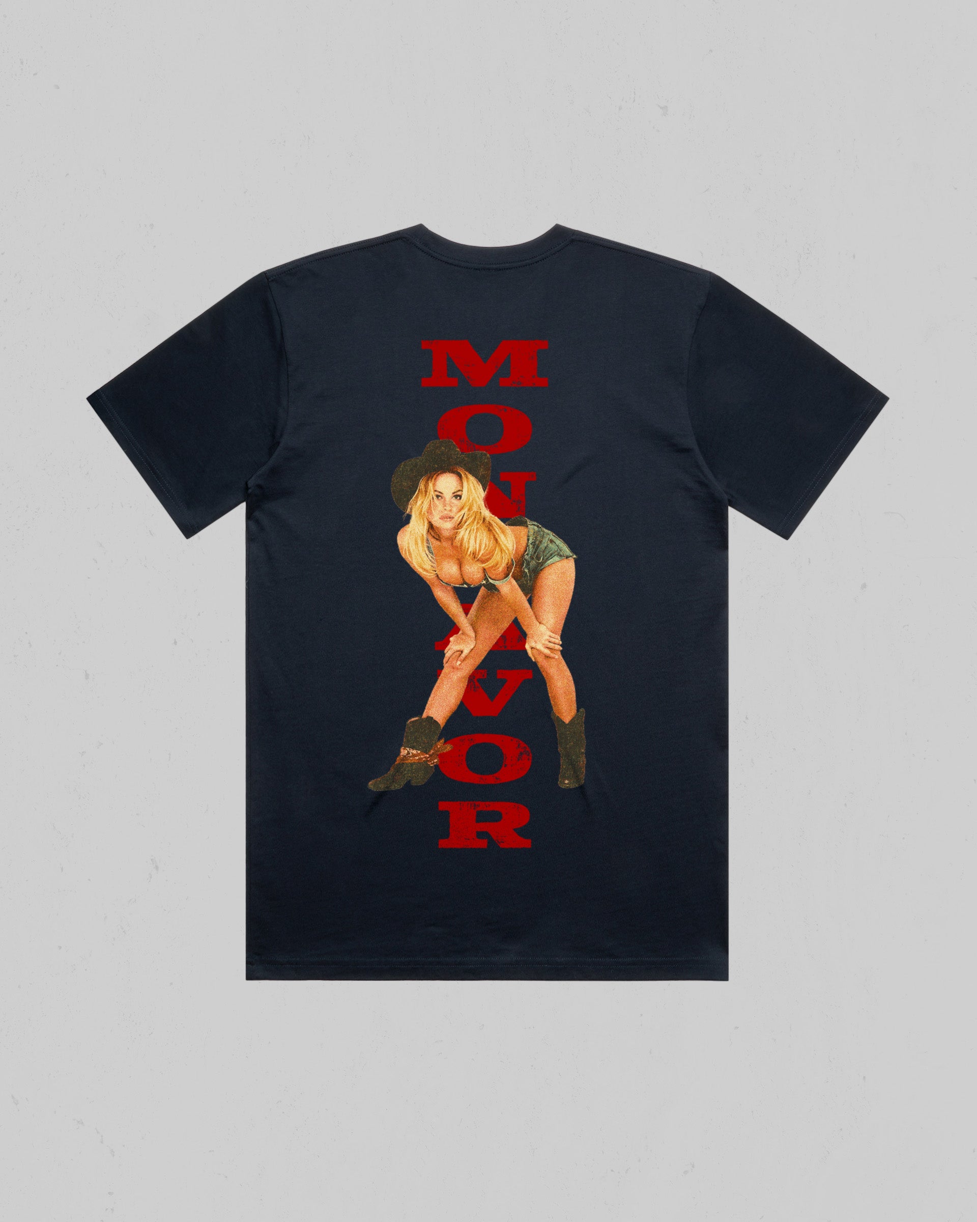 A Navy short-sleeve t-shirt with a graphic print featuring a pin-up style illustration of a woman and the word 'MONTAVOR' printed vertically in red.