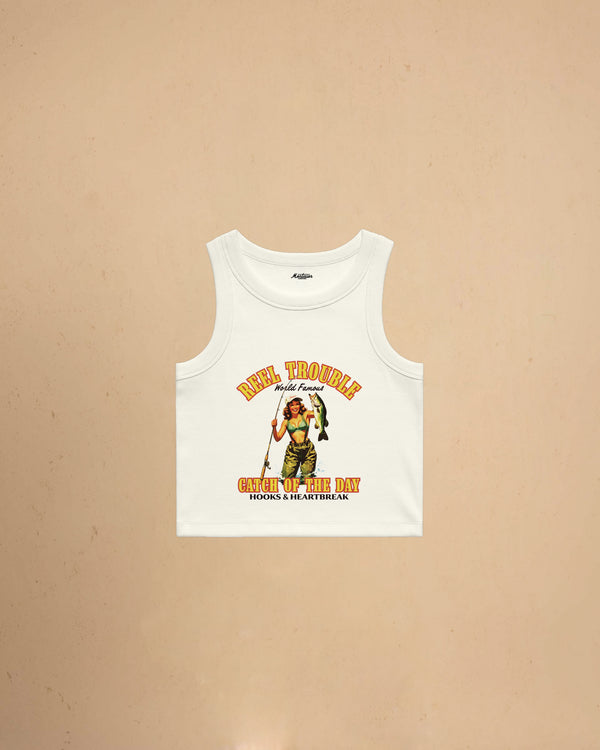 Women’s Reel Trouble organic crop tank featuring a vintage fishing pin-up graphic with retro western styling and heavyweight ribbed cotton construction.