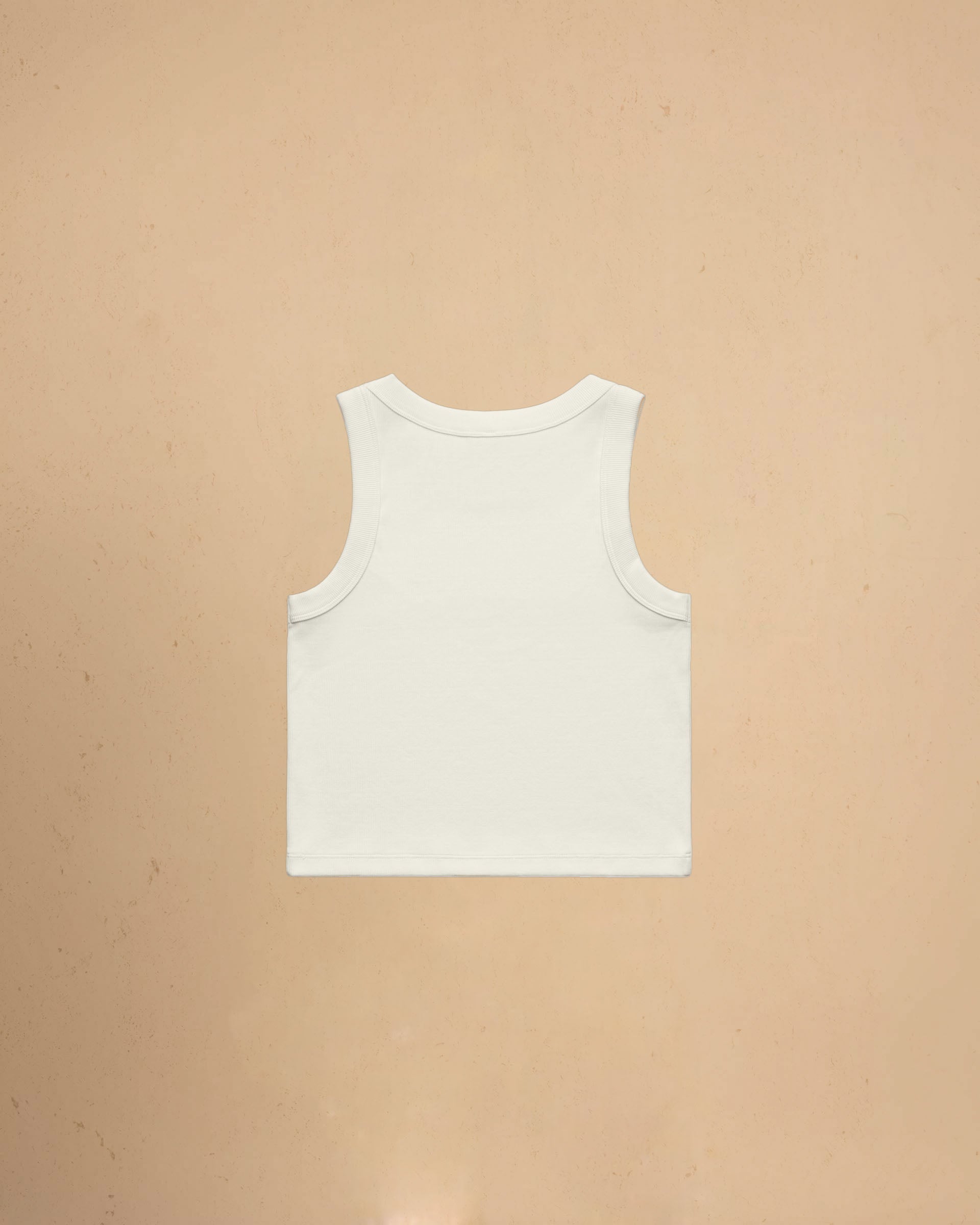 Ecru tank top on a beige background