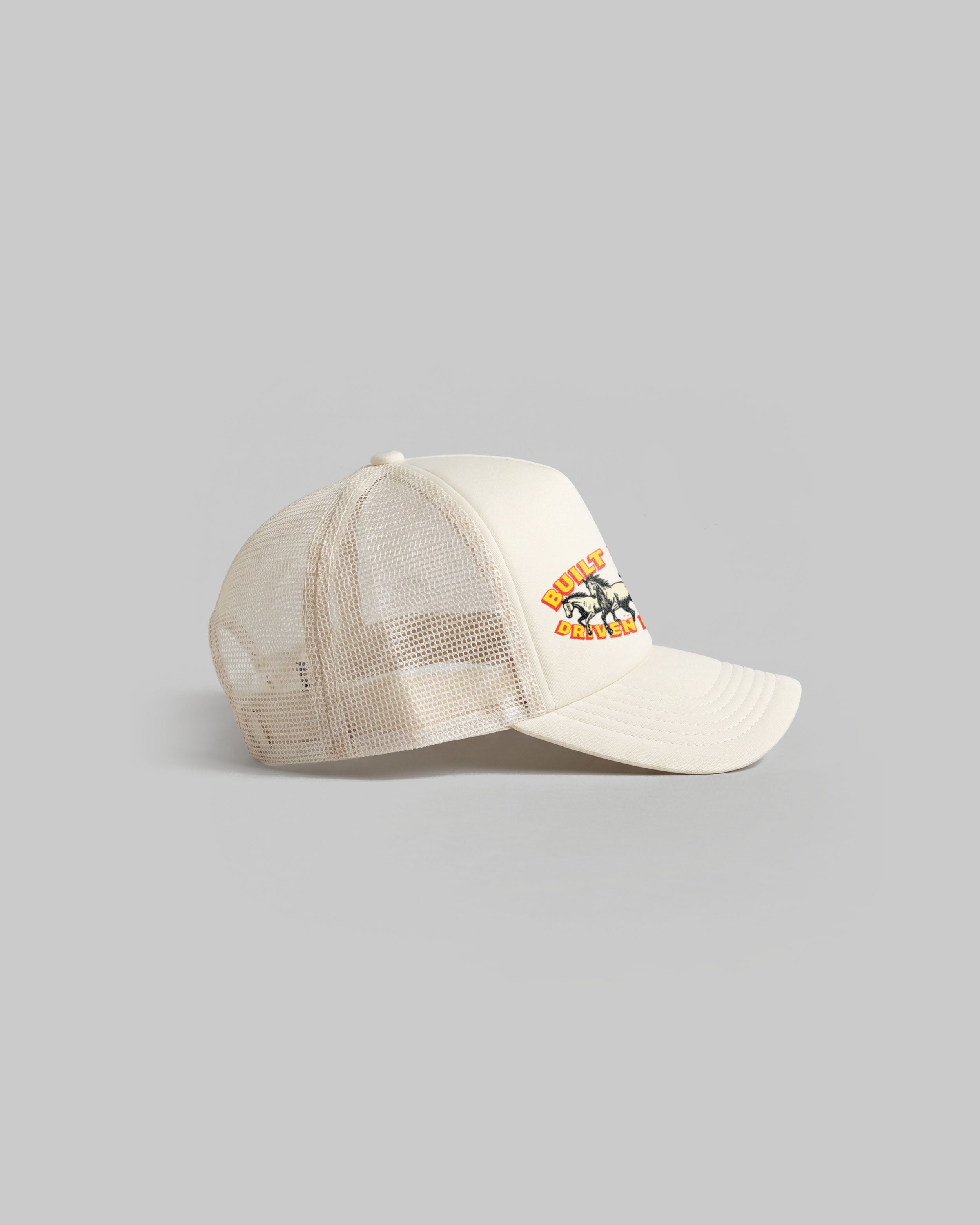 Ecru trucker cap with curved peak.