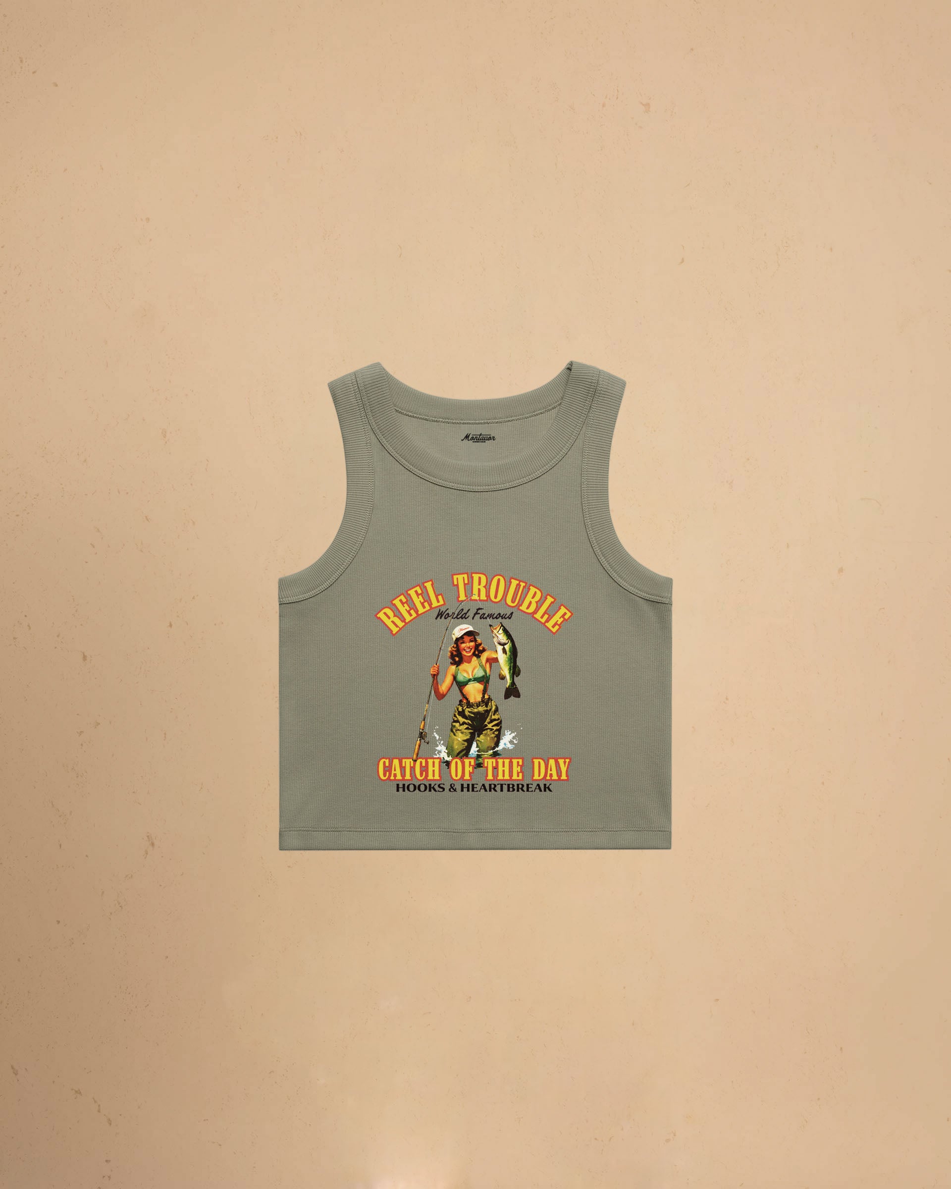 Women’s Reel Trouble organic crop tank featuring a vintage fishing pin-up graphic with retro western styling and heavyweight ribbed cotton construction.