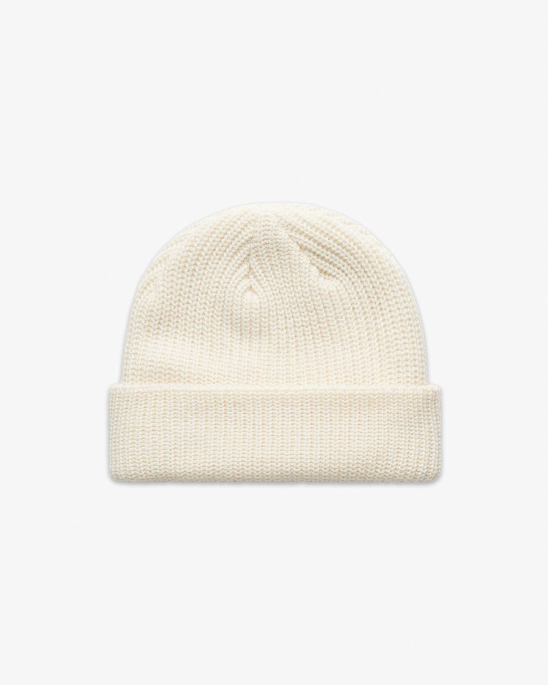 Ecru Short fisherman-style beanie with wide ribbed knit displayed flat for product detail. Main image