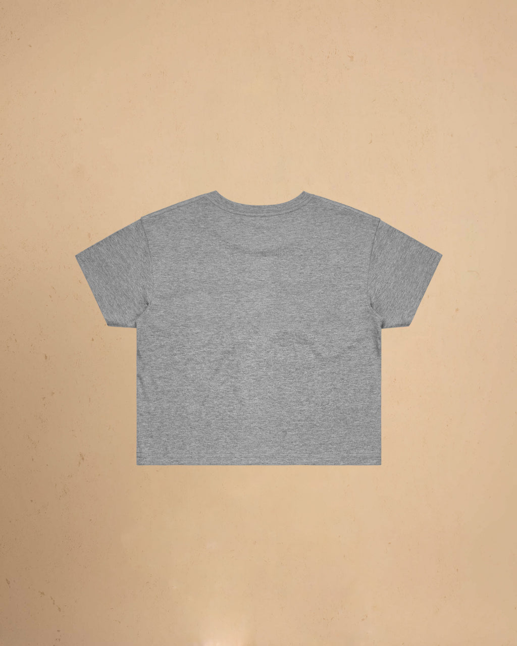 Gray t-shirt on a beige background