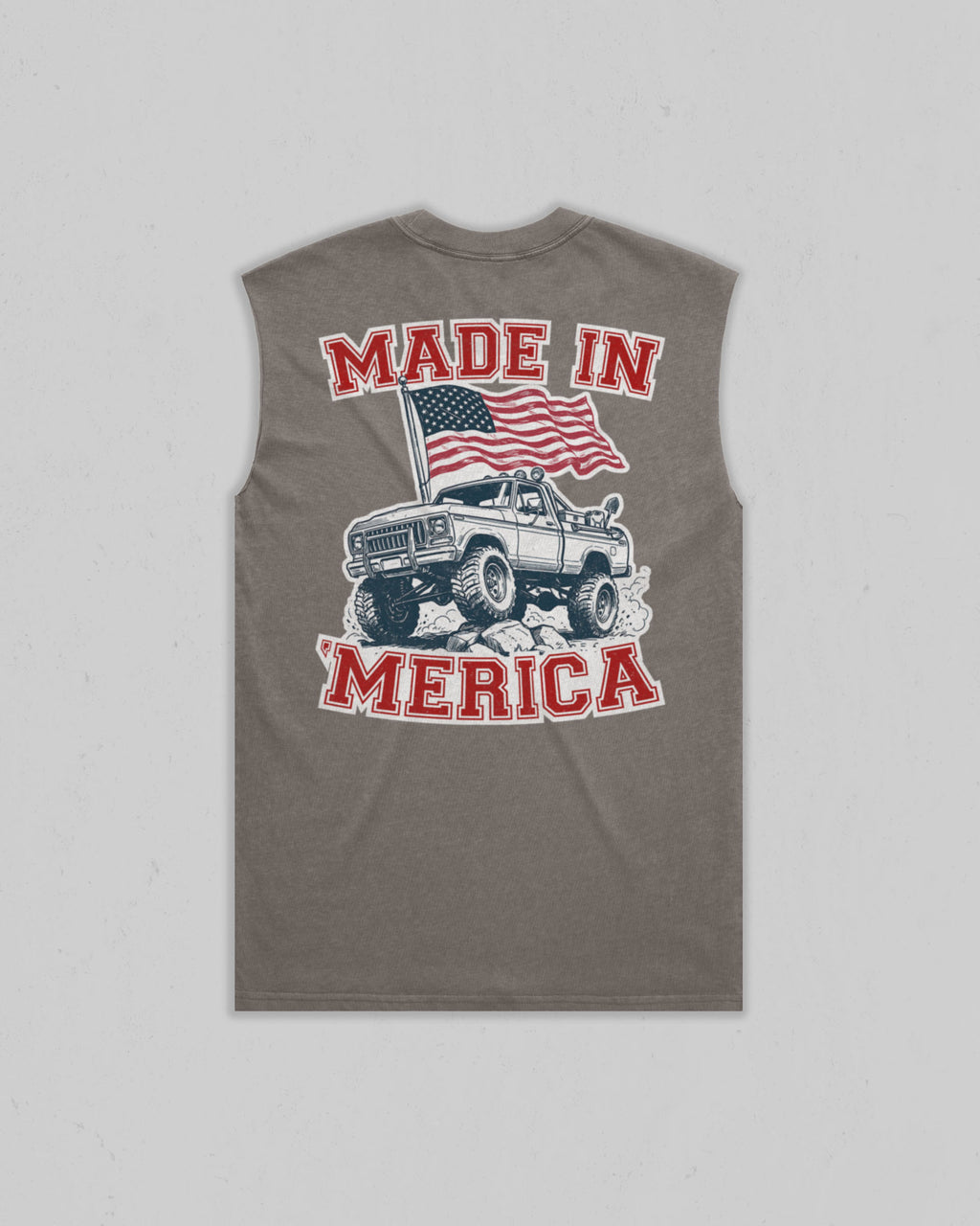 A sleeveless gray t-shirt with a graphic on the front featuring a white pickup truck, an American flag, and the text 'MADE IN MERICA' in red and white.