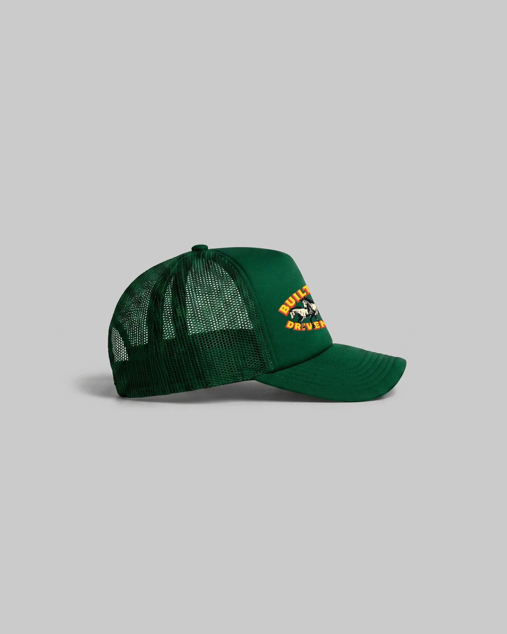 Green trucker cap with curved peak.