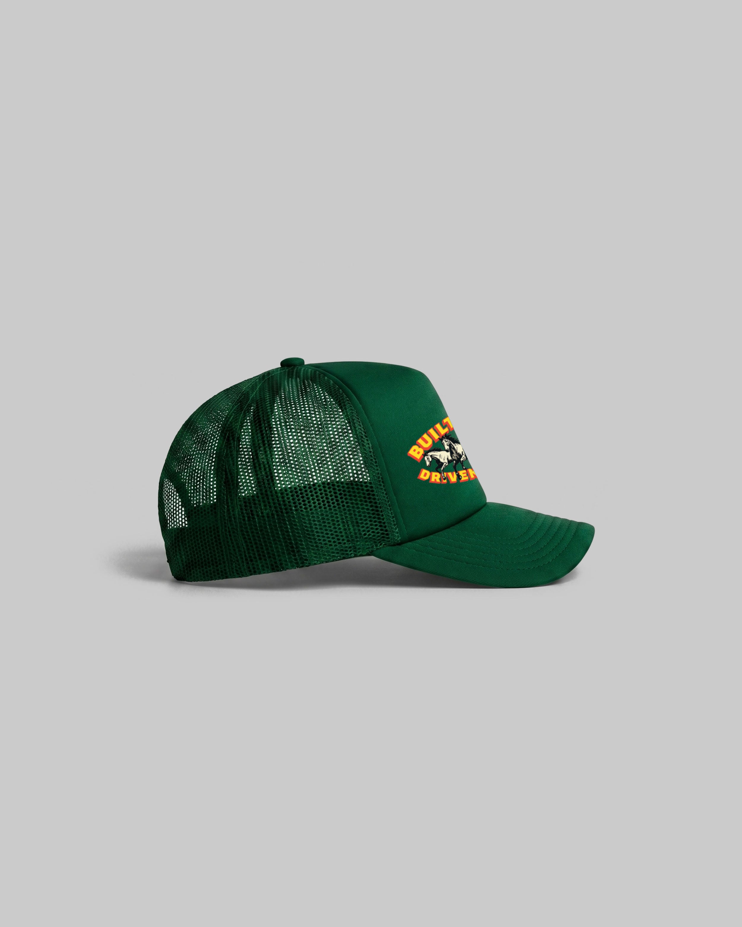 Green trucker cap with curved peak.