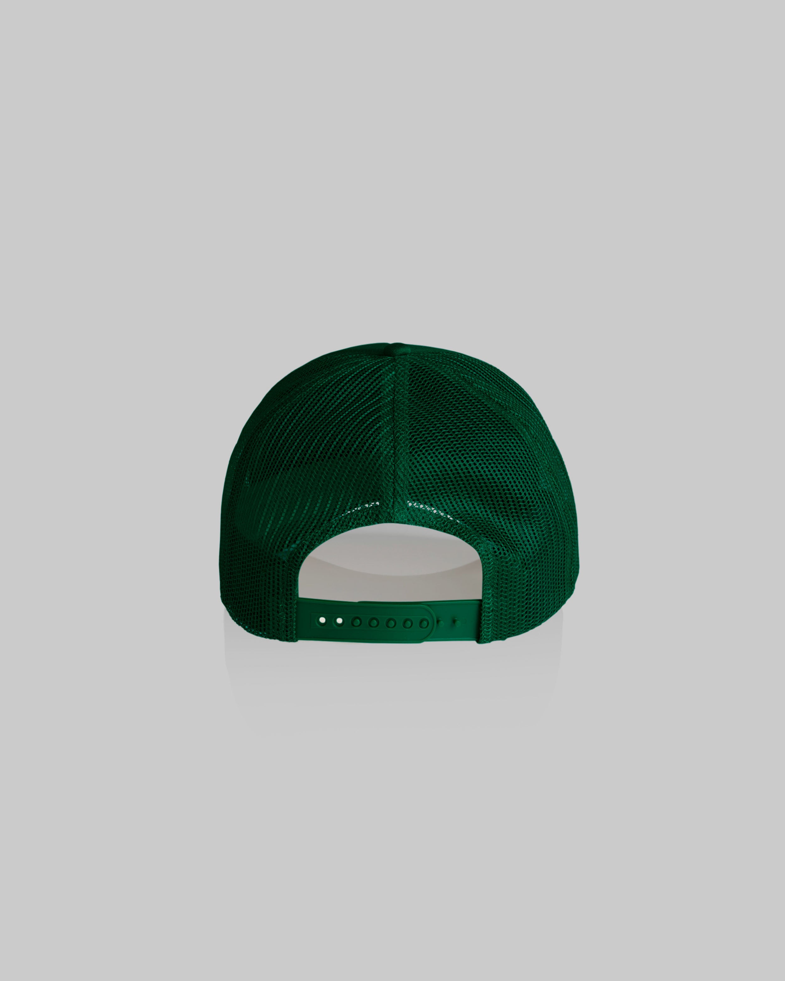 A dark green trucker-style baseball cap viewed from the back, featuring a green mesh back and a matching green adjustable strap, set against a solid light gray background.
