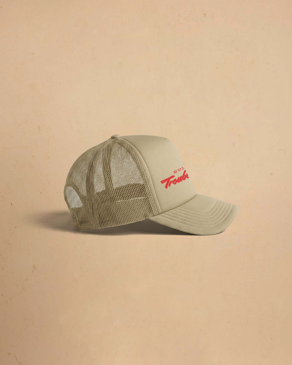 Built For Trouble trucker cap featuring a bold Western-inspired graphic on a high-profile foam-front snapback cap with breathable mesh backing.