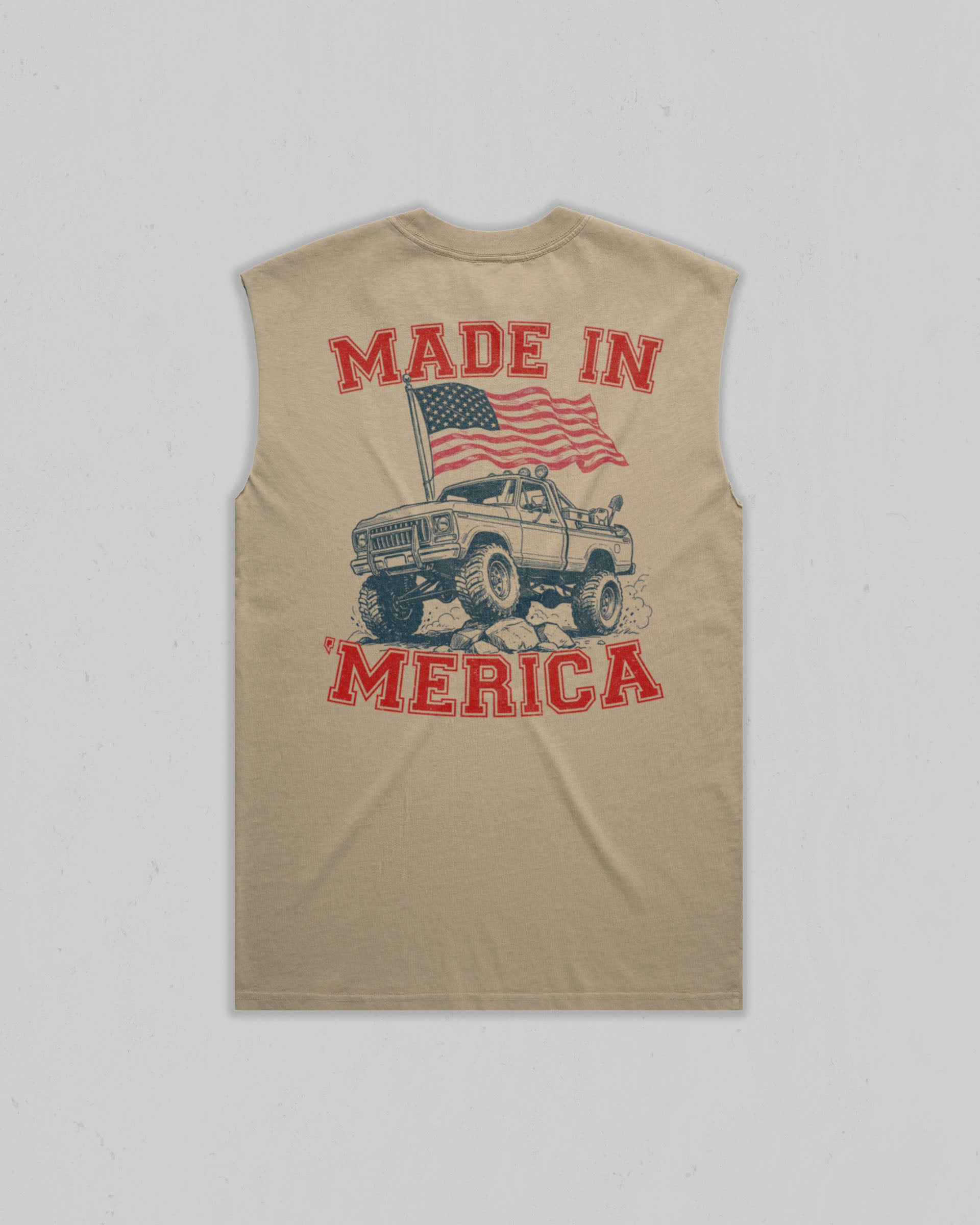 A sleeveless tan t-shirt with a vintage-style graphic on the back featuring a truck, an American flag, and the text 'MADE IN MERICA' in red and black.