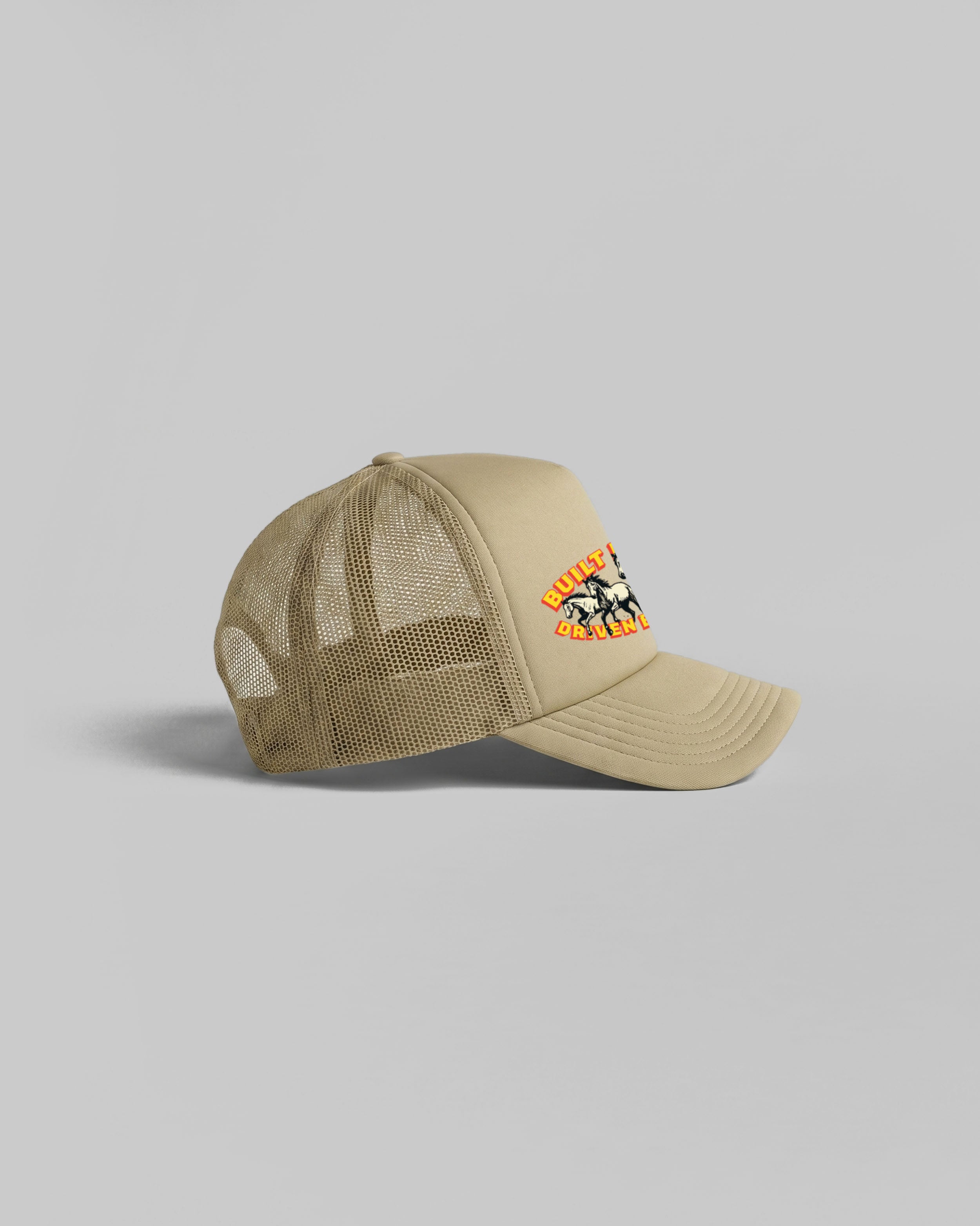 Khaki trucker cap with curved peak.