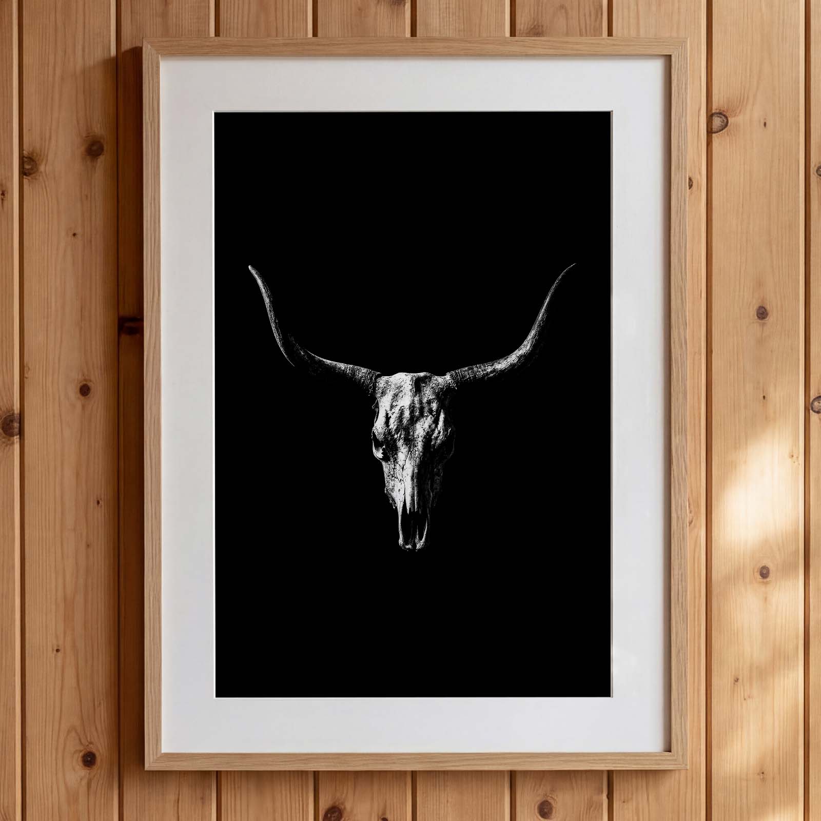 Black and white photograph of a longhorn skull with wide sweeping horns centered against a dark background, western wall art poster. Main image