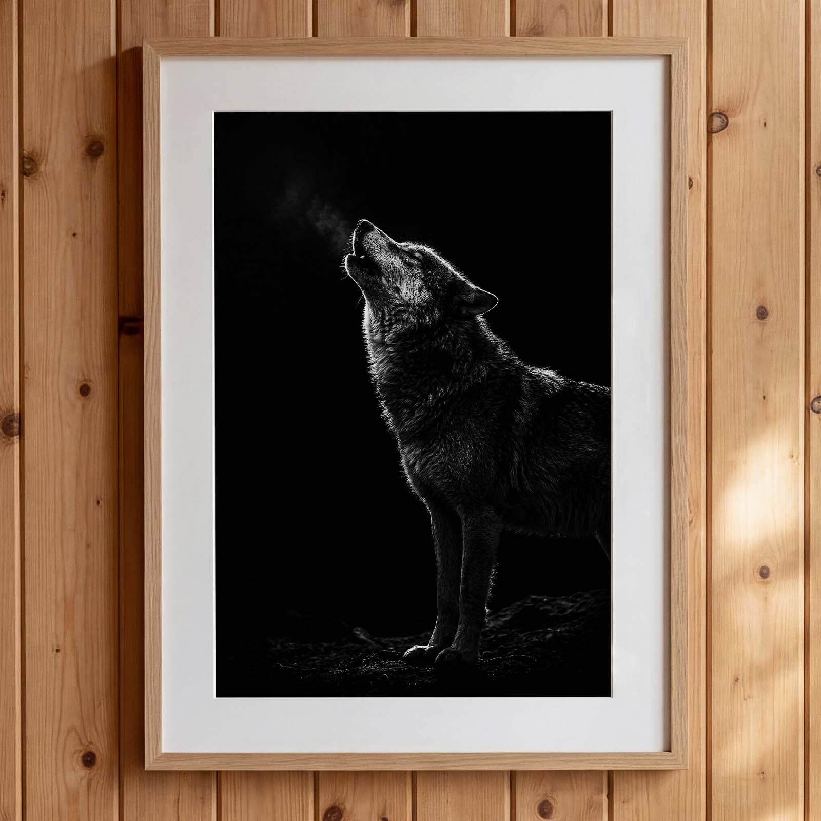 Black and white photograph of a wolf howling into the night with visible breath in cold air, wildlife wall art poster. Main image