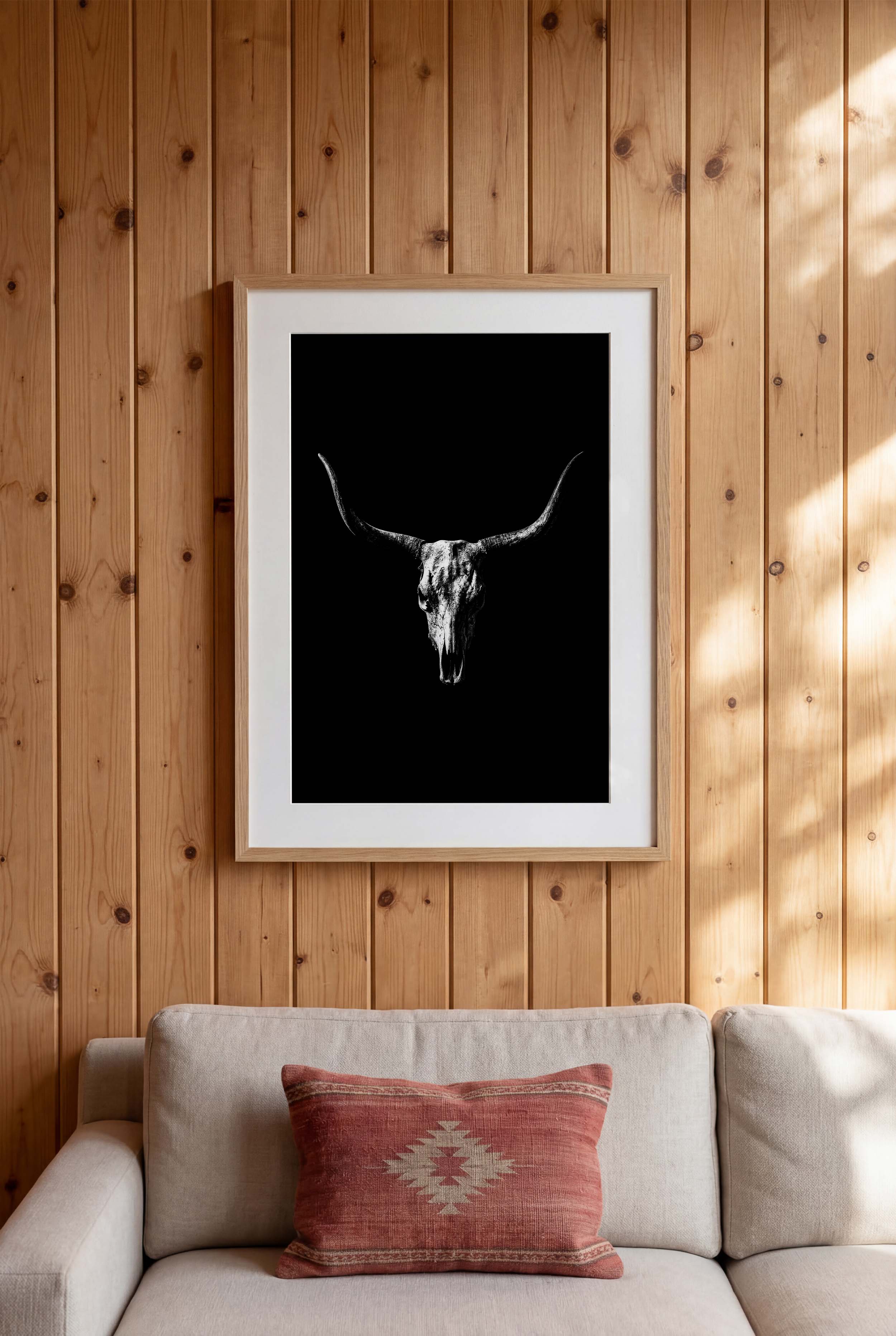 Black and white photograph of a longhorn skull with wide sweeping horns centered against a dark background, western wall art poster.