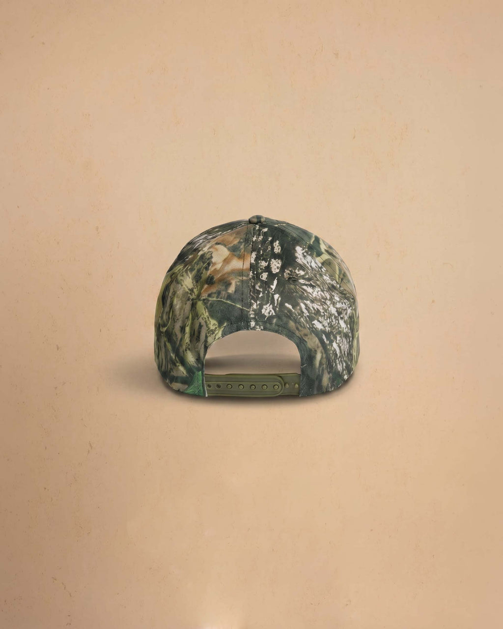 Camouflage baseball cap with 'Midnight Rodeo Club' text on a beige background
