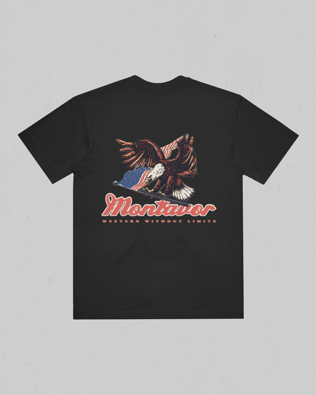 Back of Montavor Coal T-shirt with bald eagle and American flag artwork, Montavor script, and Western Without Limits lettering.