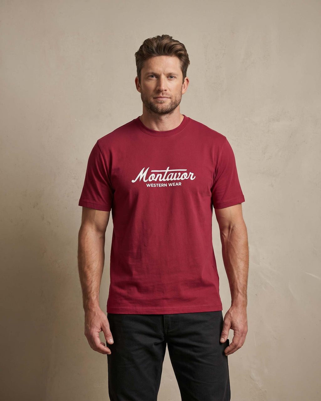 Man wearing a red t-shirt with 'Montavor Western Wear' logo against a beige background